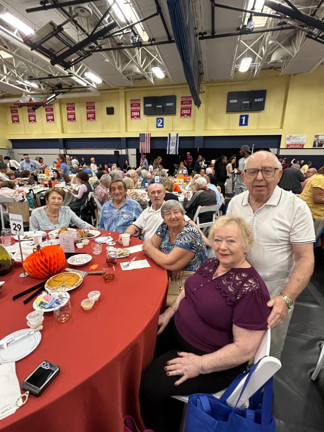 Seniors seated together at a decorated table during the Thanksgiving banquet